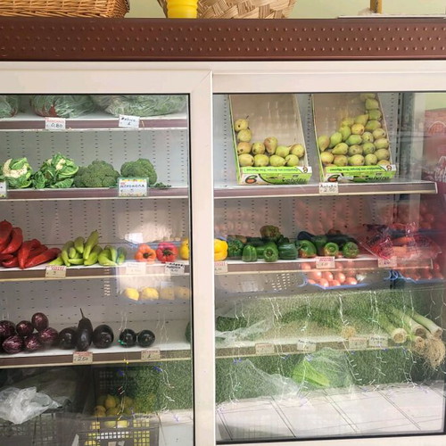 Refrigerated display case for produce used with new motor