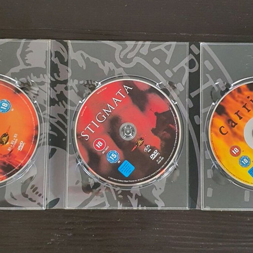 Essential Horror Collection Box Set used DVD with The Texas Chainsaw Massacre 2, Stigmata, Carrie