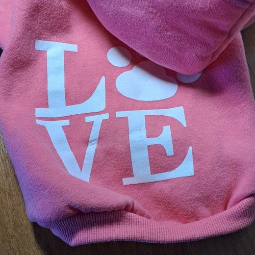 Dog accessory used, pink hoodie sweater