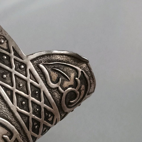 Vintage silver lighter case used with carved floral patterns