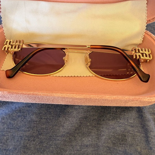 Miu Miu SMU 54ZS ZVN-70D sunglasses like new, gold frame, pink lenses