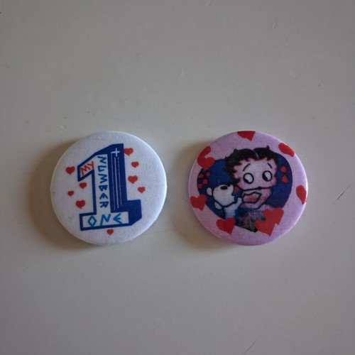 Vintage round pins set with Betty Boop and My Number One, like new