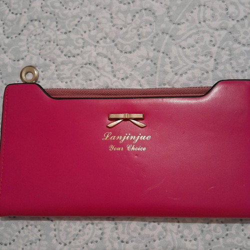 Pink wallet like new with few marks on front
