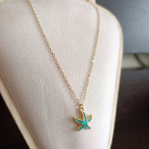 Starfish necklace in stainless steel, like new, gold color