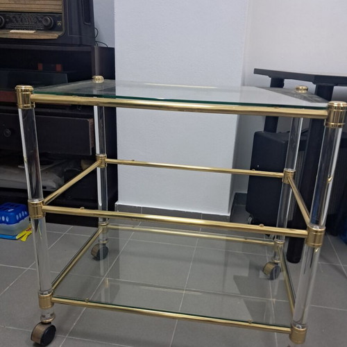 Glass coffee table with wheels, gold color