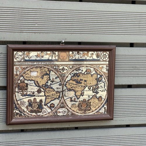 Decorative mirror with antique world map used, wooden frame