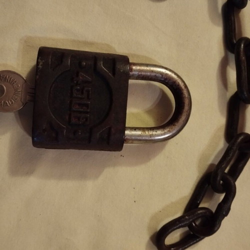 Padlock used with key, chain and skeleton key