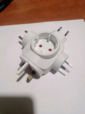 Travel adapter used with rotating center