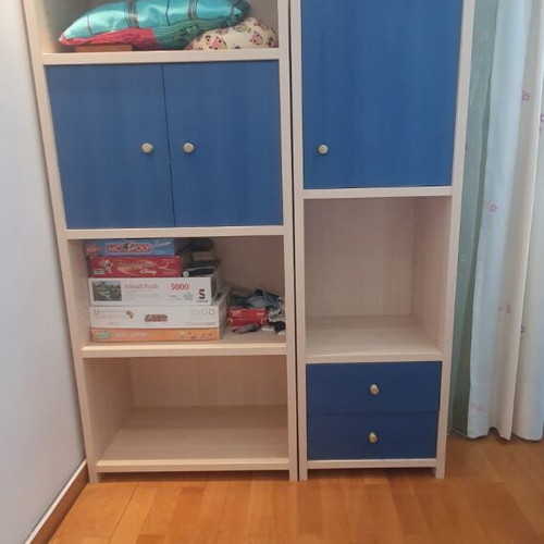 Blue bedroom set with desk, bookshelves and bed