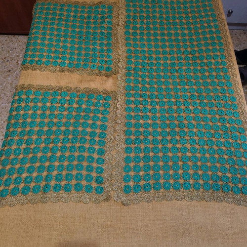 Table runner with two crocheted napkins and gold thread