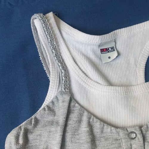 Children's dress used, gray sleeveless with ruffles and sporty back
