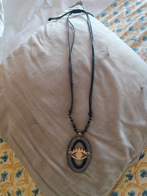 Necklace with Eye Motif like new, adjustable length, black beads