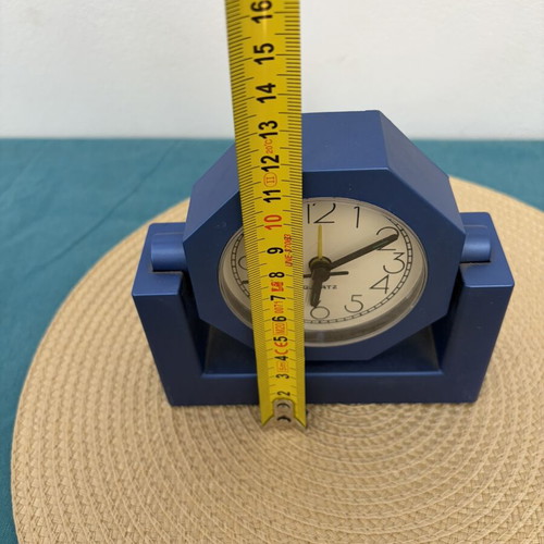 Blue analog table clock used, missing battery cover