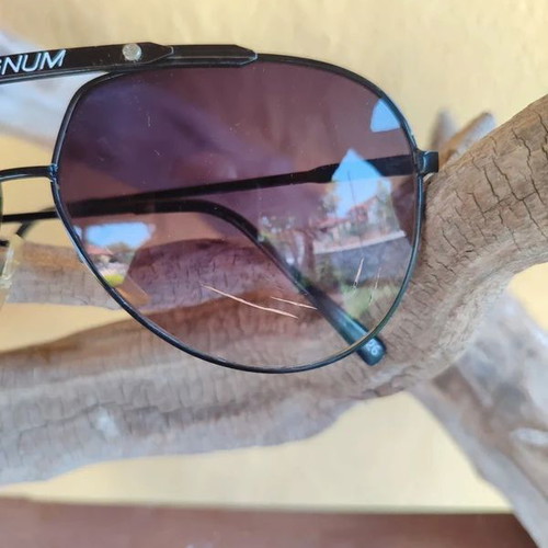 Vintage 90s Magnum sunglasses, one broken lens