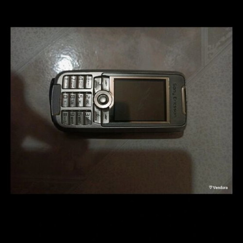 Old mobile phone used, no charger, unknown if working