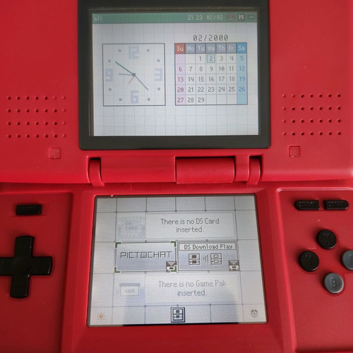 Nintendo DS (2004) console used with 2 games, charger, and accessories