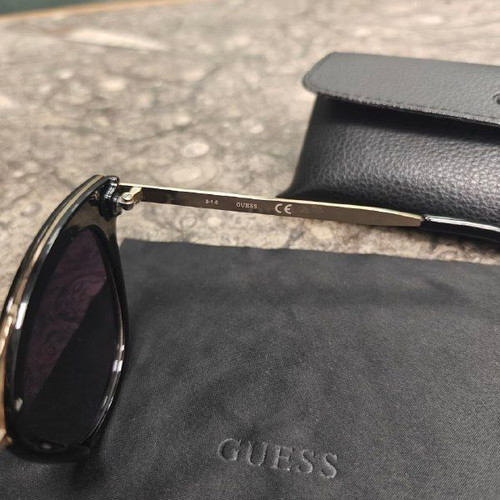 Guess women's sunglasses with black protective case and cloth