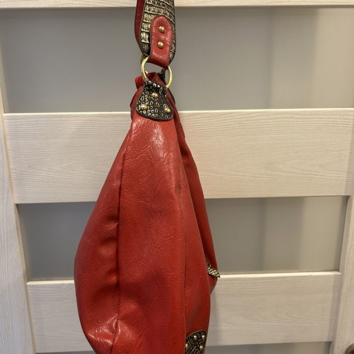 Red hobo shoulder bag like new with decorative details