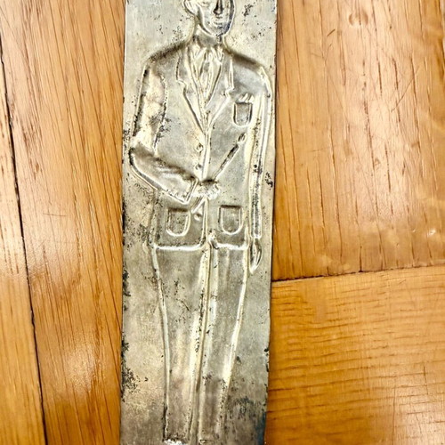 Vintage metal votive plaque with male figure used