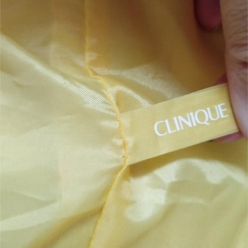Clinique shoulder bag like new, colorful, cylindrical shape