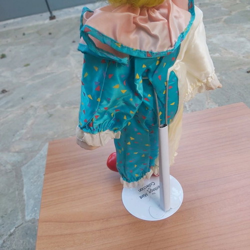 Porcelain clown doll new with stand