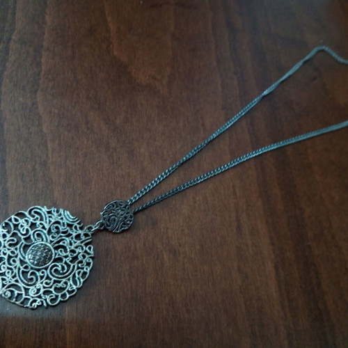 Metal pendant with pierced design used, silver color