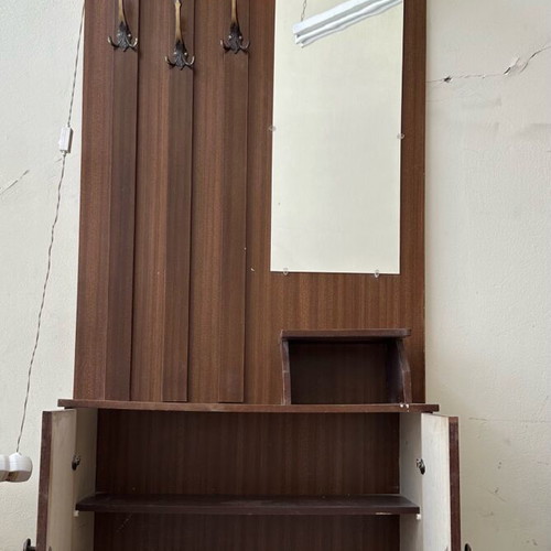 Vintage entrance furniture used with hooks, mirror and light