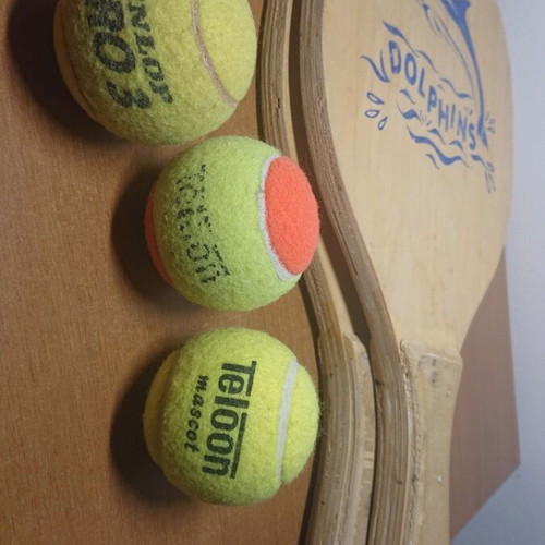 Wooden beach rackets with 3 balls used