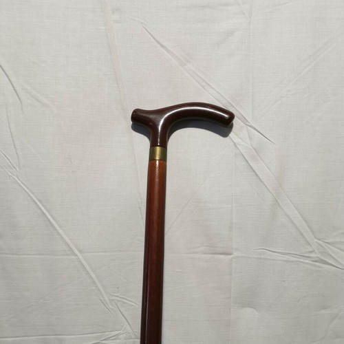 Wooden walking cane used, dark brown color