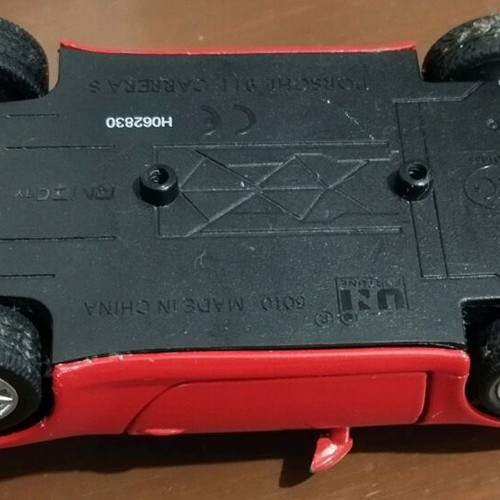 Collectible Porsche Carrera toy car with opening doors like new