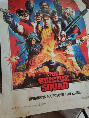 The Suicide Squad movie poster used with visible wear