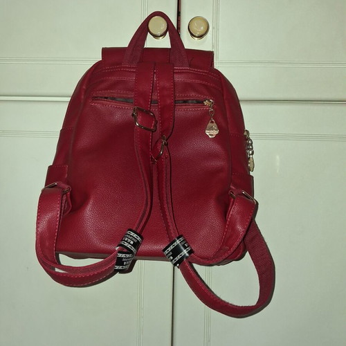 Women's red backpack with gold details