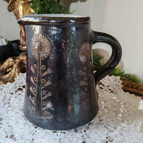 Retro ceramic milk jug with embossed flowers