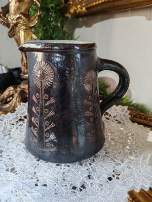 Retro ceramic milk jug with embossed flowers
