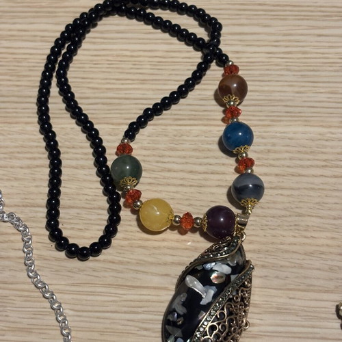 Jar treasure with assorted women's jewelry and accessories