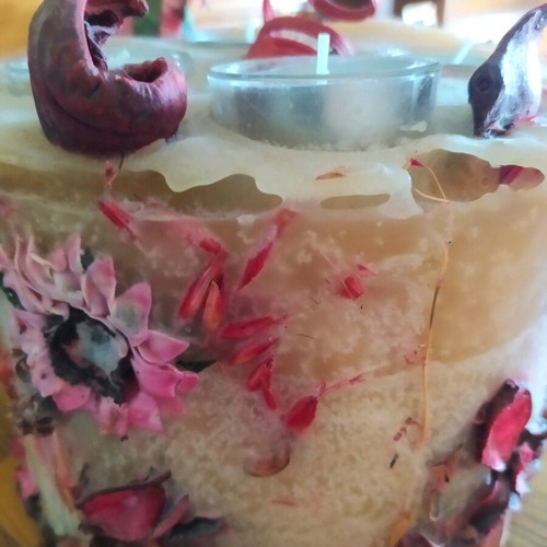 Decorative candle with dried flowers used