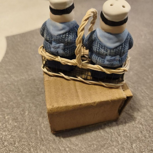 Vintage salt and pepper set with chef figures in wicker basket