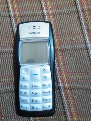 Nokia 1100 collectible used functional phone without battery and charger