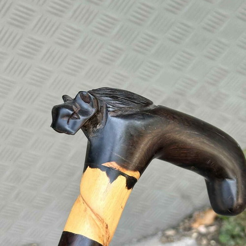 Handmade wooden cane with horse head used, carved artistic detail