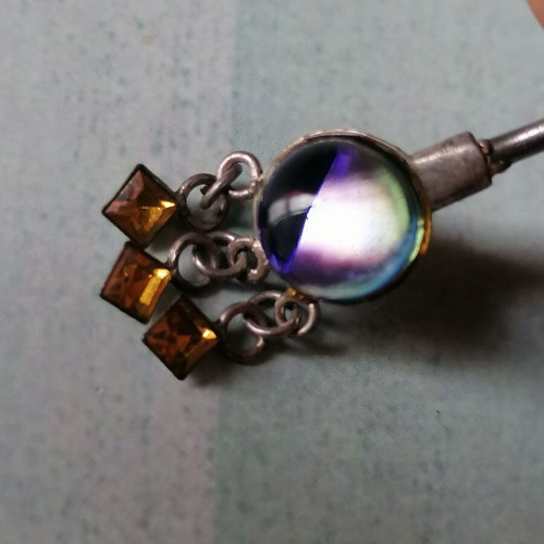 Aurora borealis navel piercing with color-changing crystal