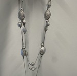 Triple necklace with silver pebble-like elements