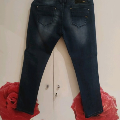 Women's blue jeans used with decorative lace on side size XL