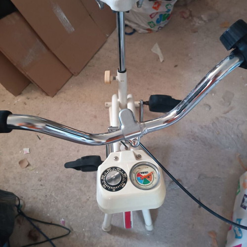 Stationary Exercise Bike used, 1990s model with adjustable resistance