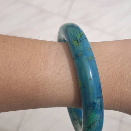 Petrol resin bracelet with flower designs like new