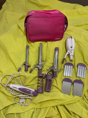 Hair Majesty 9-in-1 hair straightener used with accessories