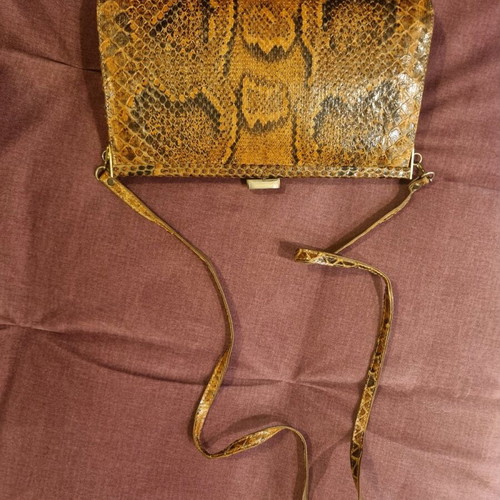 Crossbody bag used with python print leather pattern
