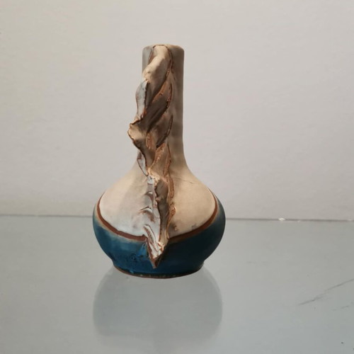 Handmade clay vase used with wavy finish