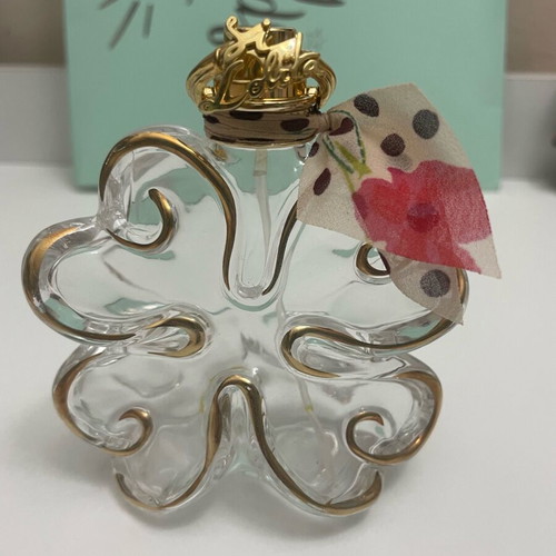 Sí Lolita Lolita Lempicka empty perfume bottle used, lucky four-leaf clover