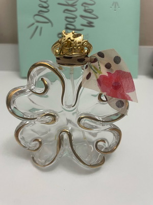 Sí Lolita Lolita Lempicka empty perfume bottle used, lucky four-leaf clover