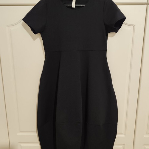 Black midi dress with pockets and asymmetrical design, one size